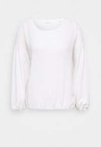 Vit långärmad topp med rund halsringning, samlade ärmslut och en mjukt texturerad tygkvalitet, med en avslappnad passform och elastisk nederkant.