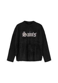 Mustan pörröinen neule, jossa pitkät hihat ja valkoinen goottilaiskirjasimella kirjoitettu "Saints'"-teksti edessä. Pyöreä pääntie, rento istuvuus.