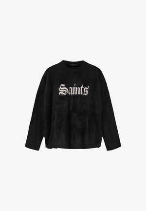 Suéter negro de peluche con mangas largas, que presenta la palabra "Saints'" en fuente gótica blanca en el frente. Cuello redondo, corte holgado.