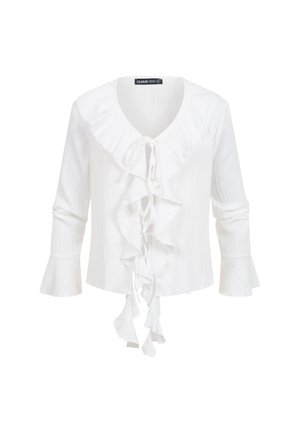 Hvid bluse med lange ærmer og flæset V-udskæring, lommeknappet lukkning foran og vidt udstående manchetter, lavet af tekstureret stof.