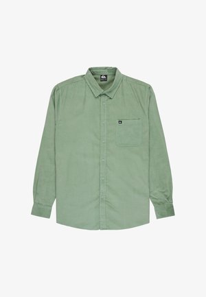 Groene corduroy shirt met lange mouwen, klassieke kraag, een voorzak en knoopsluiting. Geweven stof met subtiele verticale lijnen.
