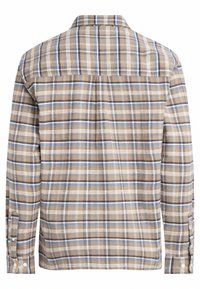Košile s dlouhým rukávem v kostkovaném vzoru v hnědých, béžových a modrých tónech. Má límec, manžety na knoflíky a zadní díl s detailem yoku. Měkká, strukturovaná tkanina.