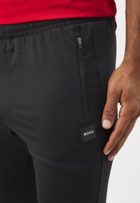 Björn Borg TRAINING PANTS - Pantalones deportivos - black beauty