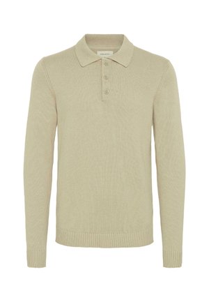 Maglione polo beige a maniche lunghe realizzato in tessuto a coste, con patta a tre bottoni e polsini e fondo a coste. Design classico del colletto.