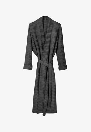 Rjavkoplav bathrobe z vzorcem vaflja, dolgimi rokavi, s pasom, do kolen, z zvitimi manšetami. Tkanina se zdi mehka in lahka.