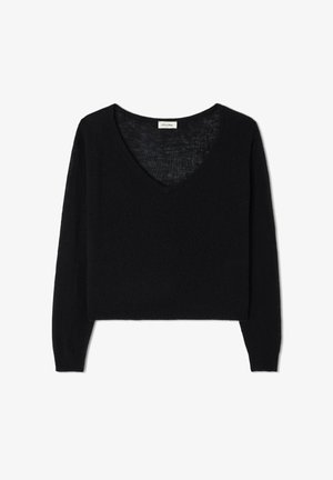 Zwarte cropped trui van zachte, gestructureerde brei-stof. Heeft een diepe V-hals en lange mouwen, met een relaxte pasvorm.
