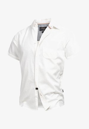 Cămașă albă cu mânecă scurtă din in, dotată cu guler cu nasturi, un buzunar pe piept și un detaliu contrastant la interiorul gulerului.