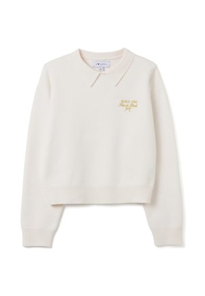 Suéter corto color crema con cuello tipo polo, adornado con bordados dorados que dicen "PARIS 1984", hecho de un suave tejido de punto.