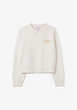 Crème-kleurige cropped sweater met een kraaglijn, voorzien van gouden borduursels met de tekst "PARIJS 1984," gemaakt van zachte gebreide stof.