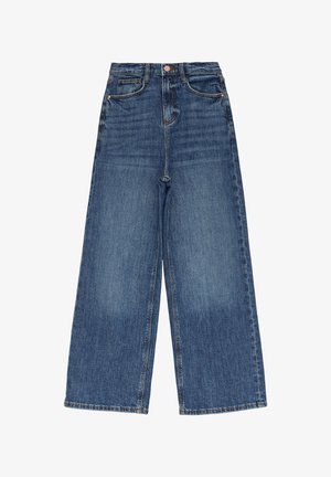 Dlhé nohavice s voľným strihom v tmavomodrom denime. Vysoký pás s piatimi vreckami a medeným kovovým dokončením. Hladká textura s jemnými efektmi vyblednutia.