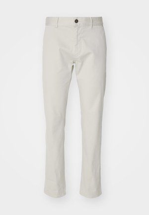 Beige cotton pants featuring a straight leg design, front pockets, a button closure, and a smooth texture.