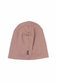 Ljusrosa mössa i mjukt, texturerat tyg. Har en subtil söm ner i mitten och en liten logotagg på sidan.