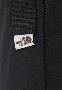 The North Face BERKELEY CROSSBODY UNISEX - Borsa a tracolla - black/mineral gold