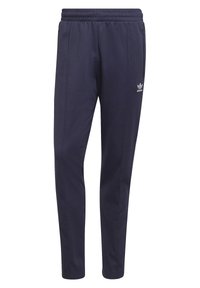 Pantaloni sportivi blu navy realizzati in tessuto morbido, con vita elasticizzata, tasche laterali e un piccolo logo bianco sulla gamba sinistra.