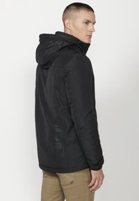 Koroshi Jachetă outdoor - black