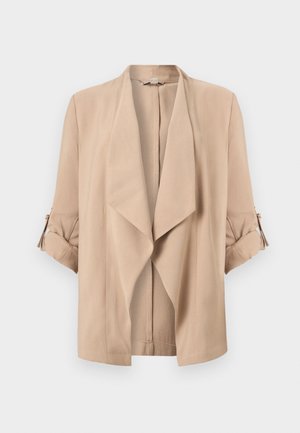 Veste beige à ouverture devant avec revers cascade et manches trois-quarts dotées de poignets retroussés et pattes boutonnées.