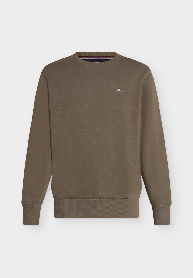 Brun sweatshirt med rund hals og lange ærmer, med ribstrikkede manchetter og kant, der har en lille broderet logo på venstre bryst.