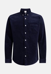 Chemise en velours côtelé bleu marine à manches longues avec col boutonné, poche avant et boutons blancs. Tissu texturé avec un motif côtelé.