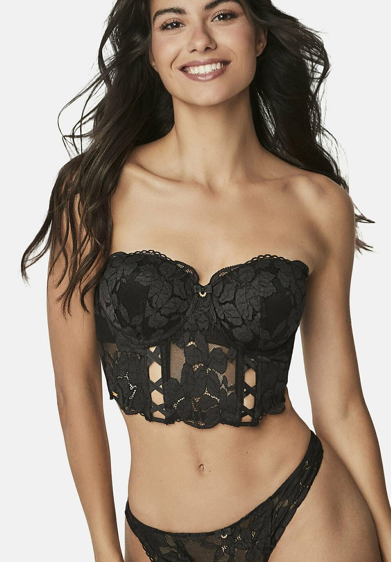 Zwarte kanten korset top met een strapless ontwerp, bloemenpatronen, decoratieve hardware en sheer gaas insets met uitsnijdingen.