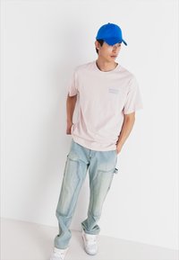 Levi's® VINTAGE FIT GRAPHIC - Nyomott mintás póló - potpourri