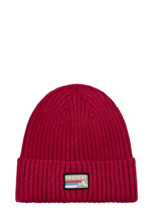Red ribbed knit beanie made of soft material, featuring a folded cuff and a rectangular logo patch with mountain design and stripes.