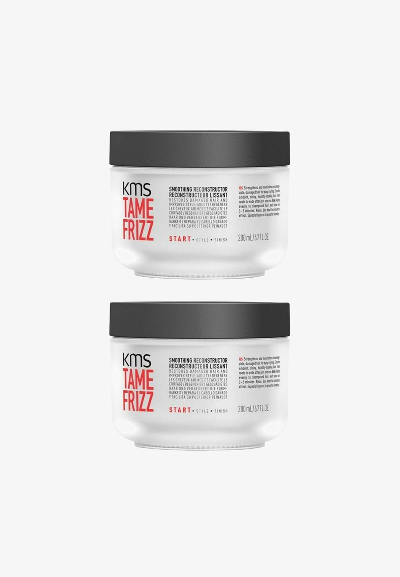 KMS Tame Frizz Glättungsreconstructor in einem klaren Behälter mit schwarzem Deckel. 200 mL Kapazität. Der Text auf dem Etikett beschreibt Anwendung und Vorteile.