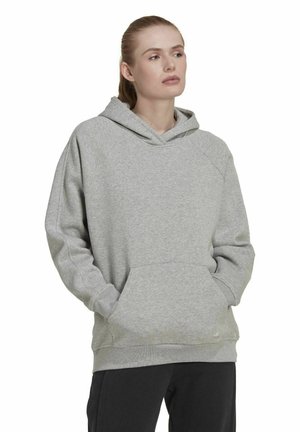 Sudadera gris hecha de un tejido suave. Cuenta con un bolsillo frontal, capucha con cordón y mangas raglán. Diseño sencillo con puños y dobladillo de canalé.