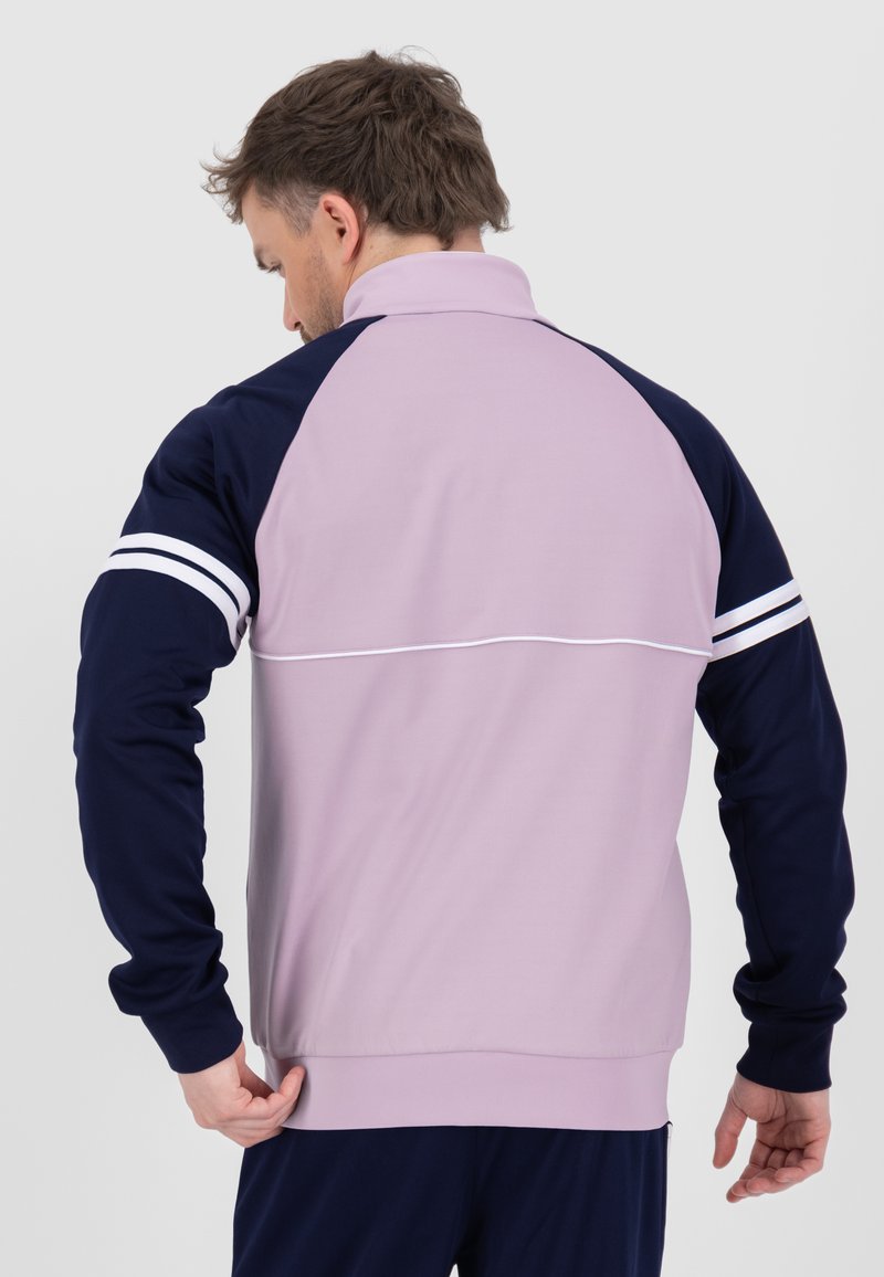 The Orion Davis Track Top in Thistle Navy🔥 Available at selected retailers #sergiotacchini