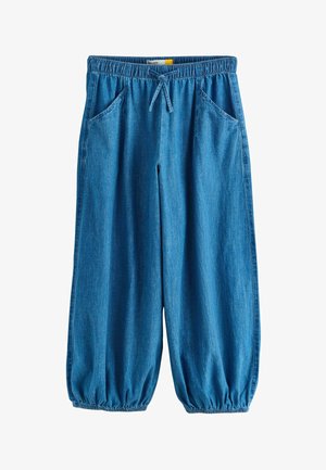 Blue denim loose-fit pants with elastic waistband, drawstring, side pockets, and elastic cuffs at ankles.