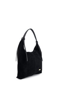 Czarna torba na ramię ze zamszu z długimi, supełkowymi skórzanymi paskami, gładką fakturą i małym złotym akcentem po boku. Prostokątny kształt.