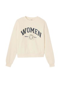 Sweatshirt couleur crème avec un col rond, des manches longues et une coupe courte. Présente le texte "FEMMES" et un graphique "DEPUIS 1975" en marine. Texture douce.