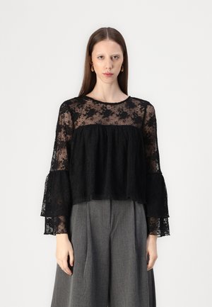 Black lace blouse with flared sleeves, featuring a sheer upper section with floral patterns and a layered pleated lower section.
