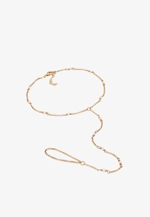 Halskette aus Gold mit kleinen weißen Perlenakzenten, mit einem Verschluss und einem zarten Design. Ideal zum Schichten oder als Einzelstück.