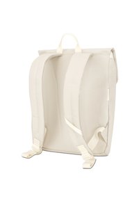 Beige canvas backpack with padded shoulder straps, dual top handles, and flat stitching detail. Simple design, no external pockets or vibrant colors.