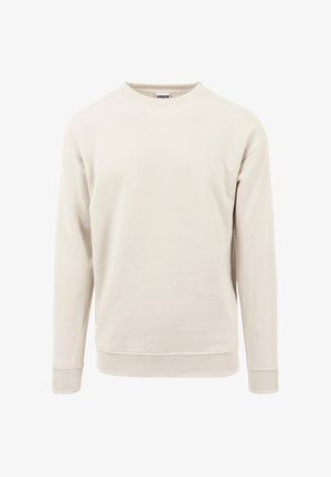 Ljusbeige sweatshirt i mjukt tyg, med rundhals, långa ärmar och ribbade muddarna vid ärmarna och nederkanten.