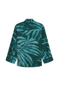 Grüne Button-up-Bluse mit einem Blättermuster, verfügt über atmungsaktive Ausschnitte, lange Ärmel und eine lockere Passform.