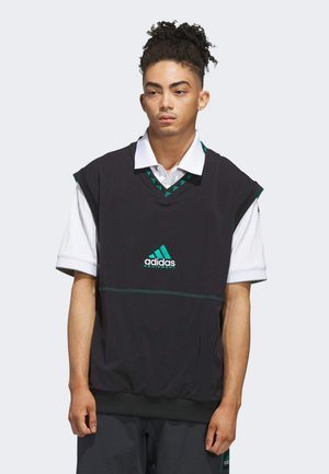 Sort ærmeløs top med v-hals og grønne accenter, der har Adidas-logoet i turkis. Lavet af letvægtsmateriale med en afslappet pasform.