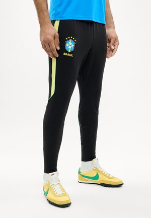 Nike Performance BRAZIL STRIKE PANTS - Article de supporter d'équipe nationale - black/yellow pulse/(infrared 23) (no spon-player)