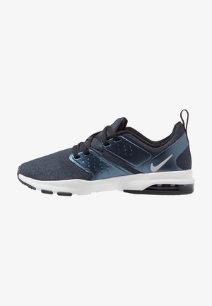 Scarpa da ginnastica Nike da uomo di colore blu scuro con lacci neri, suola bianca e cuscinetto d'aria trasparente nel tallone, vista laterale su sfondo bianco.