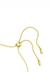 Collana in metallo dorato con catena ad anelli, chiusura tonda e due accenti cilindrici, il tutto con una finitura lucida.