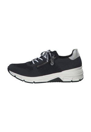 Black athletic shoe with mesh and smooth materials. Features a silver heel accent, white laces, and a zipper detail on the side.
