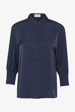 Chemise bleu marine à manches rayées, avec un col, des boutons fins et des manches bouffantes au niveau des trois quarts, dotée de poignets smockés, fabriquée dans un tissu lisse.