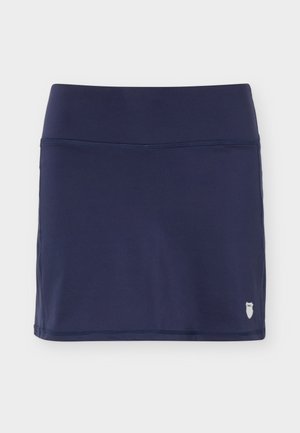 Navy blue athletic skirt with wide waistband and small white tennis shield logo on lower right side.