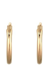 Boucles d'oreilles en métal doré présentant un design lisse et arrondi avec une légère torsion sur le dessus, reflétant la lumière grâce à une finition polie.