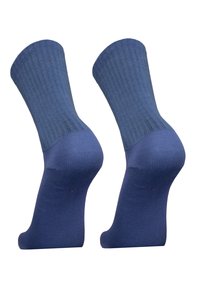 Blue cotton socks with ribbed texture. Ankle-high design featuring a smooth footbed and reinforced heel, showing a solid, uniform color.