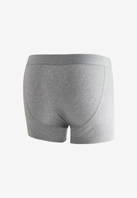 Boxer en coton gris avec une ceinture élastique, présentant une texture lisse et un design simple, avec une vue de dos.