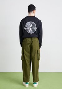 Manastash FLEX CLIMBER - Kargopüksid - oliv