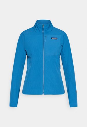Blue zip-up jacket with a high collar, featuring a textured pattern, front pocket, and side zipper pockets. Made from lightweight fabric.