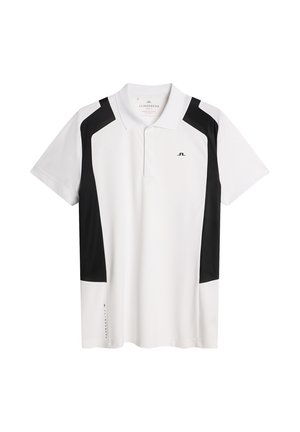 Vit polo skjorta med svarta detaljer. Kortsleeves, klassisk krage, tillverkad av slät tyg. Har en logo på bröstet och sidodetalj.