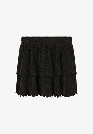 Jupe noire à design superposé, fabriquée en tissu texturé avec des fils métalliques subtils. Taille élastique et ourlet ondulé.